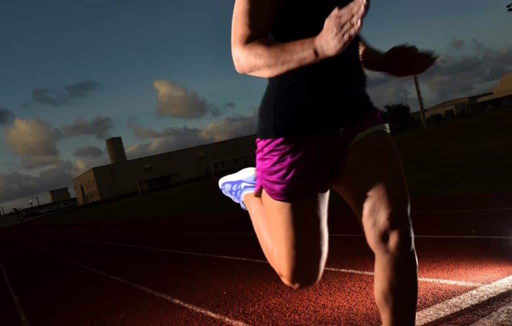 athlete running in a track