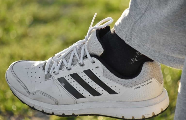 man outdoors wearing classic sports sneakers