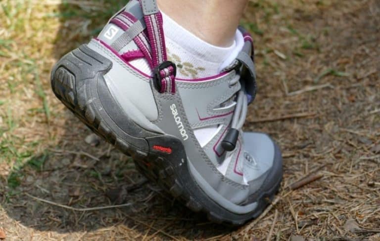 person wearing grey and pink hiking sports shoes