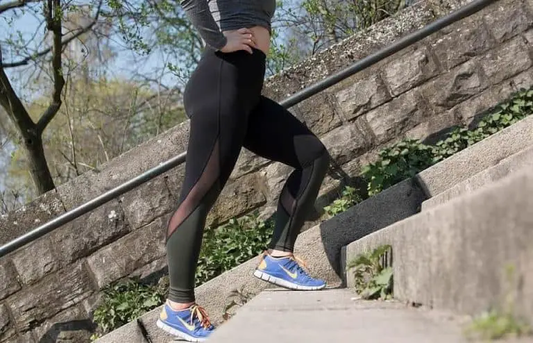 woman walking up the stairs exercising