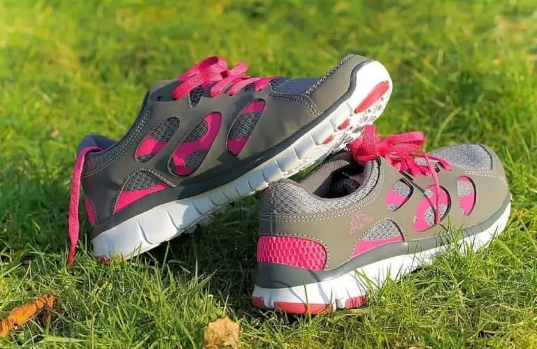 White and pink nike sneakers on green grass