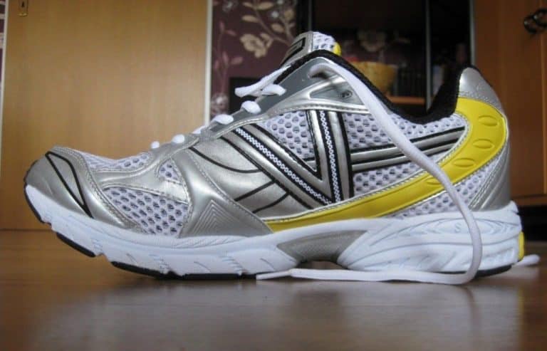 black and yellow tennis sports shoes