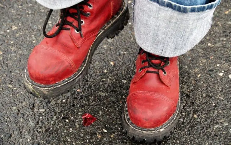 person wearing heavy red steel-toed boots
