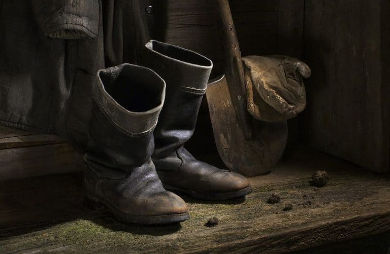 retro work boots and a shovel